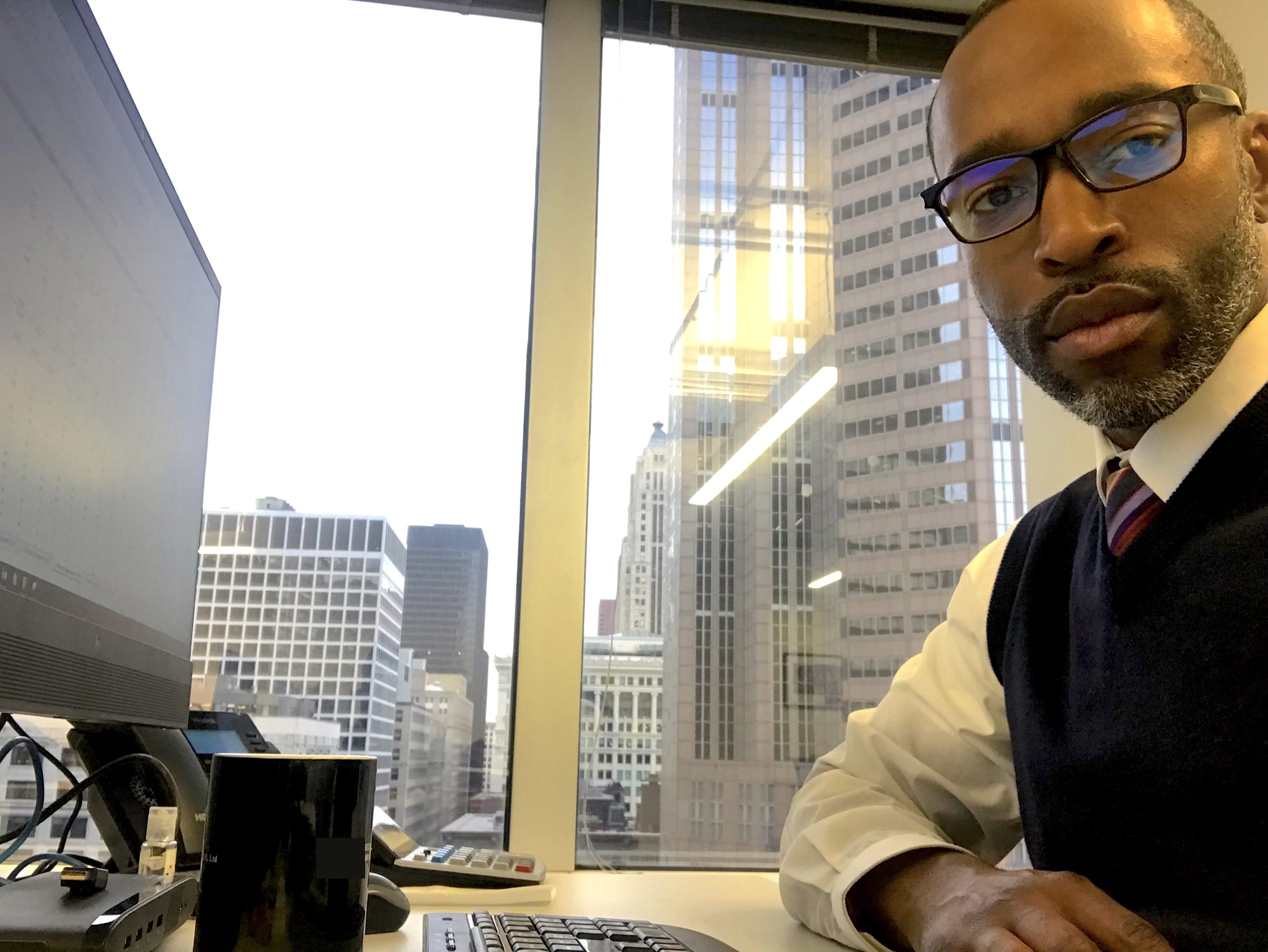 Justin B. McClelland at his workstation in a downtown Chicago office.